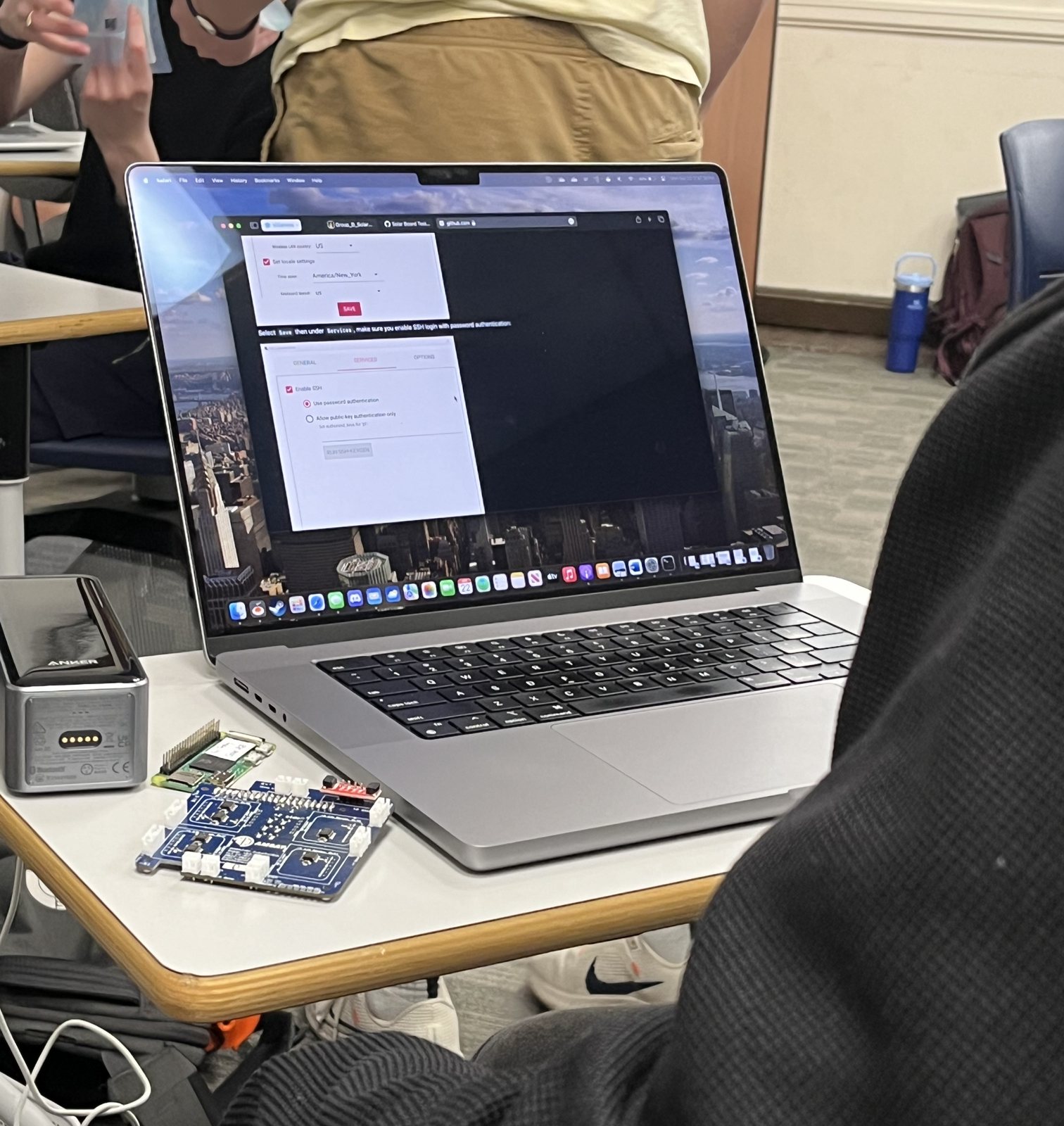 CubeSat solar board and laptop in a Villanova engineering lab